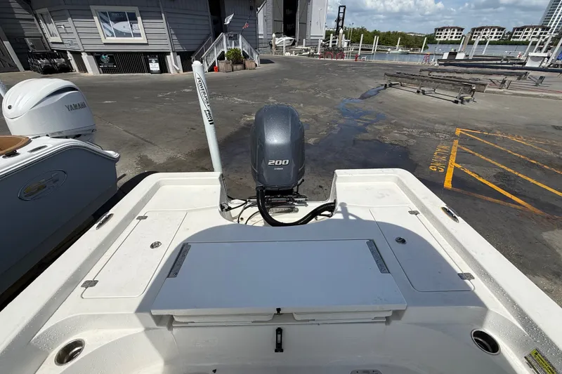 Slide: The Image of 2013 Sportsman Masters 227 Bay Boat with Yamaha engine at a marina dock. - 29