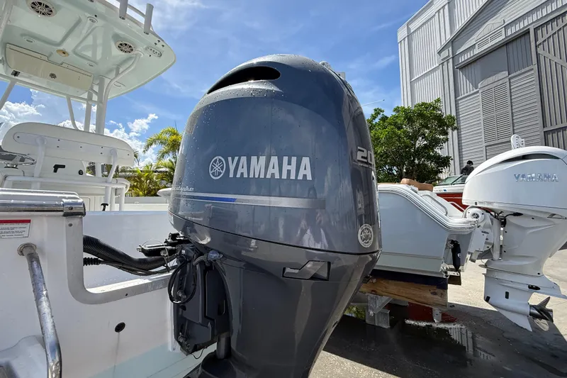 Slide: The Image of 2013 Sportsman Masters 227 Bay Boat with Yamaha outboard motor, docked outdoors. - 33