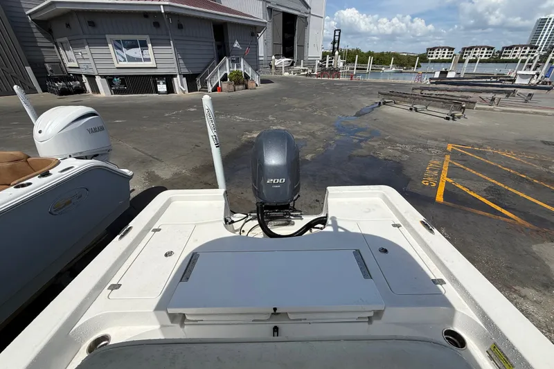 Slide: The Image of 2013 Sportsman Masters 227 Bay Boat with Yamaha engine at marina dock. - 30