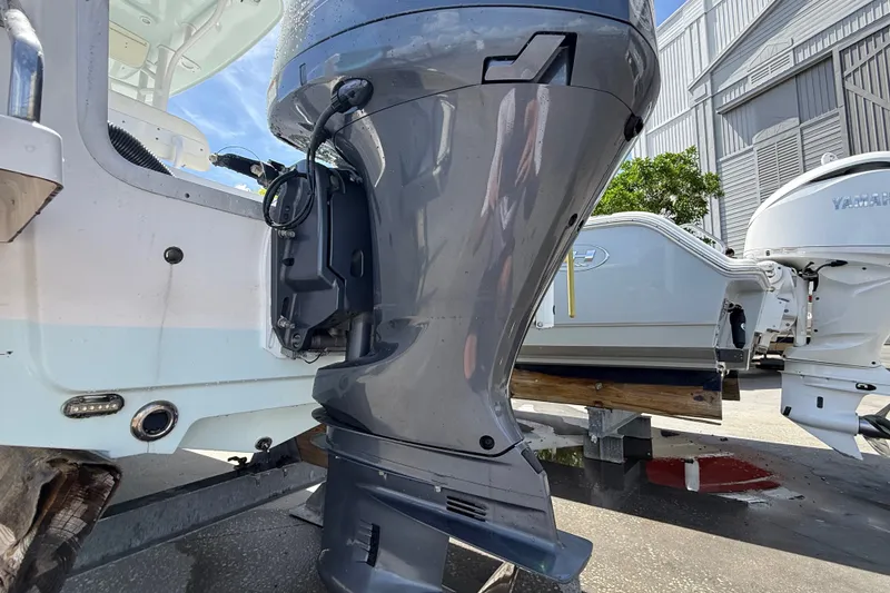 Slide: The Image of 2013 Sportsman Masters 227 Bay Boat with Yamaha outboard motor in a marina setting. - 34