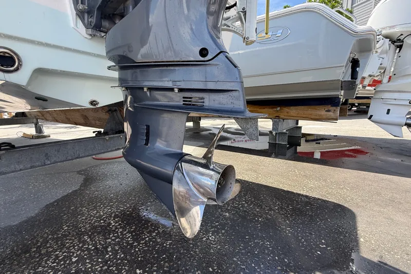Slide: The Image of Outboard motor of 2013 Sportsman Masters 227 Bay Boat on trailer. - 35