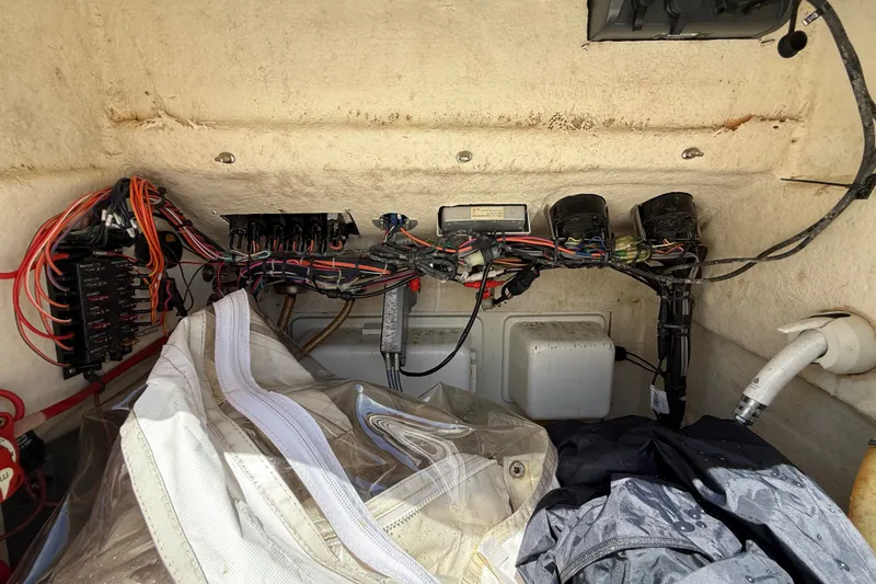 Slide: The Image of 2013 Sportsman Masters 227 Bay Boat wiring and storage compartment. - 32