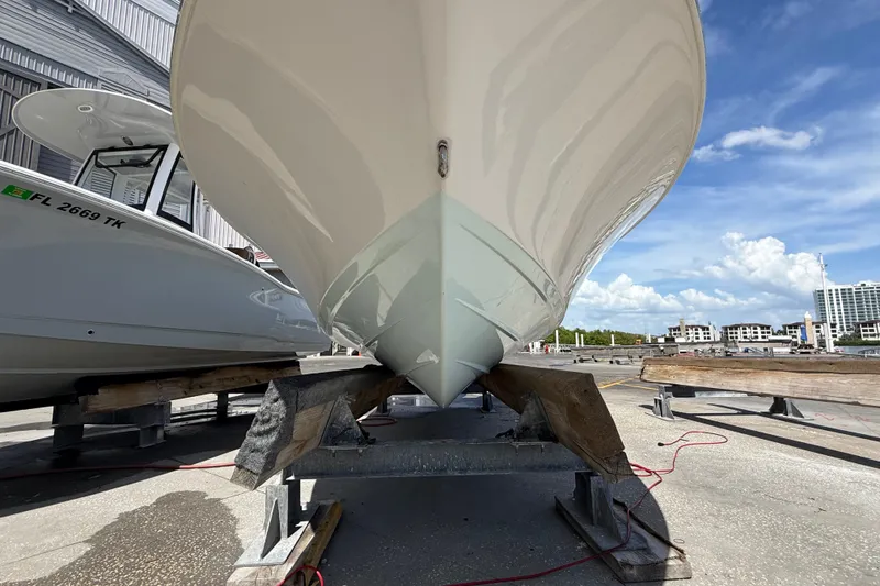 Slide: The Image of 2013 Sportsman Masters 227 Bay Boat on dry dock, clear sky background. - 7