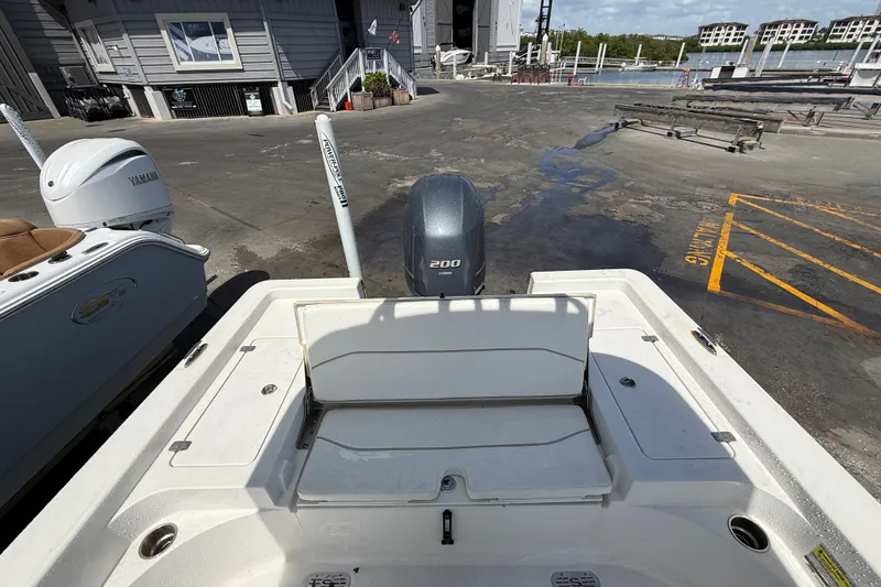 Slide: The Image of 2013 Sportsman Masters 227 Bay Boat at dock with Yamaha engine, marina background. - 28