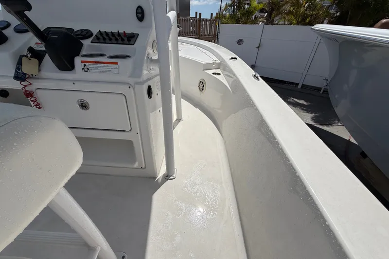 Slide: The Image of 2013 Sportsman Masters 227 Bay Boat interior with control panel and seating. - 13
