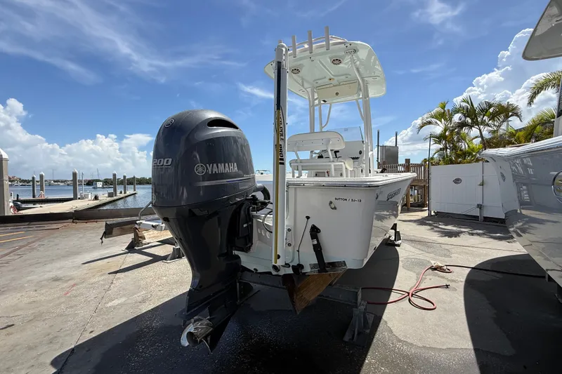 Slide: The Image of 2013 Sportsman Masters 227 Bay Boat with Yamaha engine at marina dock. - 4