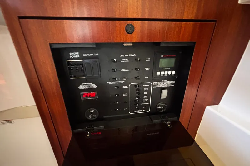 Slide: The Image of Electrical control panel on a 2015 Pursuit SC 365i Sport Coupe boat. - 9