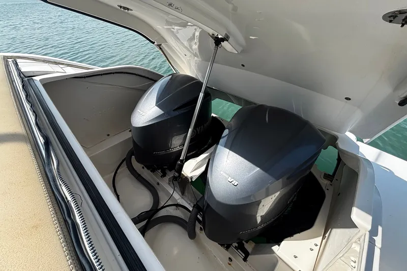 Slide: The Image of 2015 Pursuit SC 365i Sport Coupe with dual Yamaha V8 engines, open engine compartment. - 28