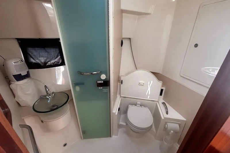 Slide: The Image of 2015 Pursuit SC 365i Sport Coupe bathroom with modern fixtures and frosted glass door. - 14