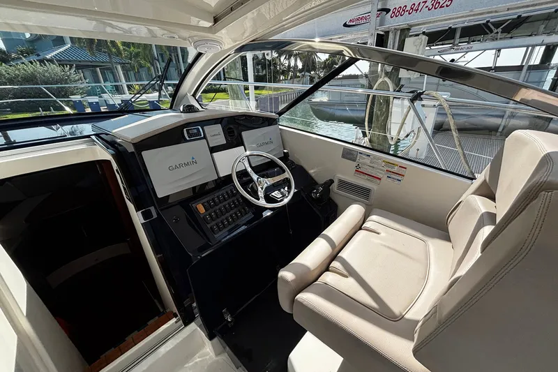 Slide: The Image of Helm of 2015 Pursuit SC 365i Sport Coupe with Garmin navigation system. - 19