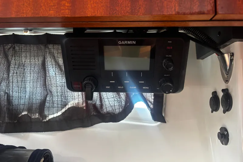 Slide: The Image of Garmin marine radio inside 2015 Pursuit SC 365i Sport Coupe boat cabin. - 12