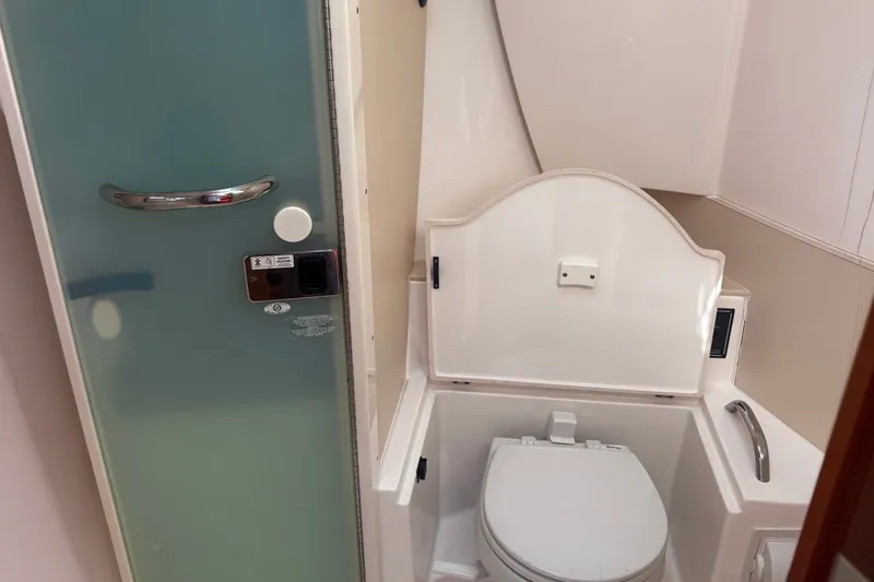 Slide: The Image of Bathroom interior of 2015 Pursuit SC 365i Sport Coupe with modern fixtures. - 15