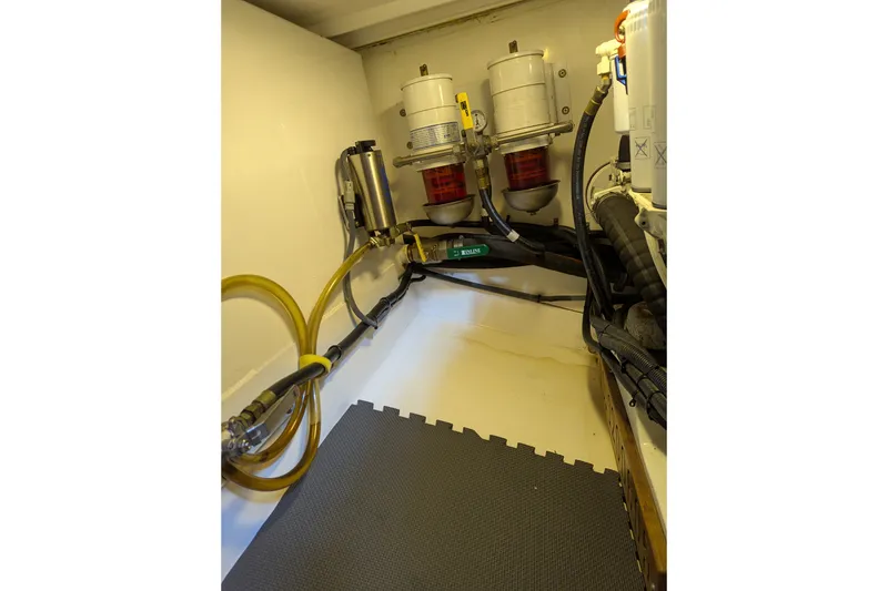 Slide: The Image of Engine room of 2007 Legacy 32 boat with fuel filters and hoses. - 29
