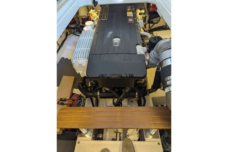 Slide: The Image of Engine compartment of a 2007 Legacy 32 boat, showcasing detailed mechanical components. - 27