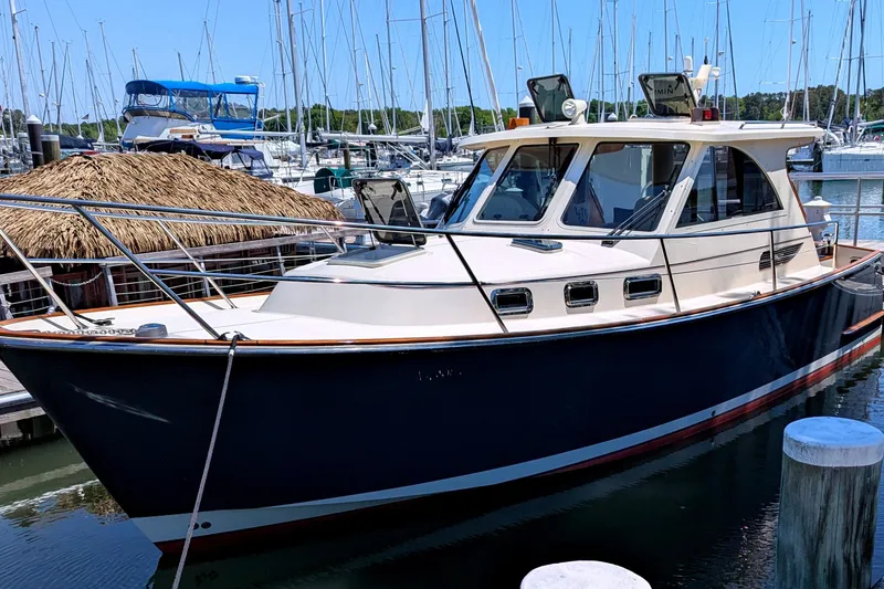 The Image of Legacy 32 boat from 2007 docked in a marina with sailboats in the background. - 0