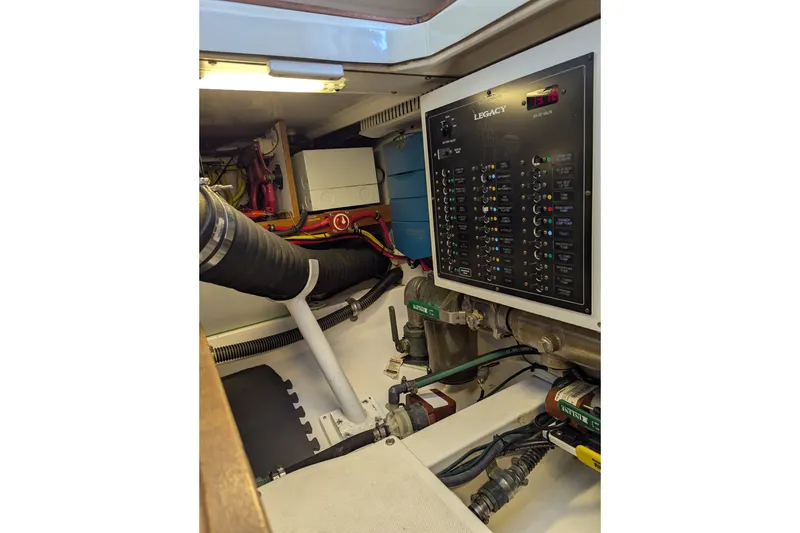 Slide: The Image of Electrical panel and components inside a 2007 Legacy 32 boat engine room. - 30