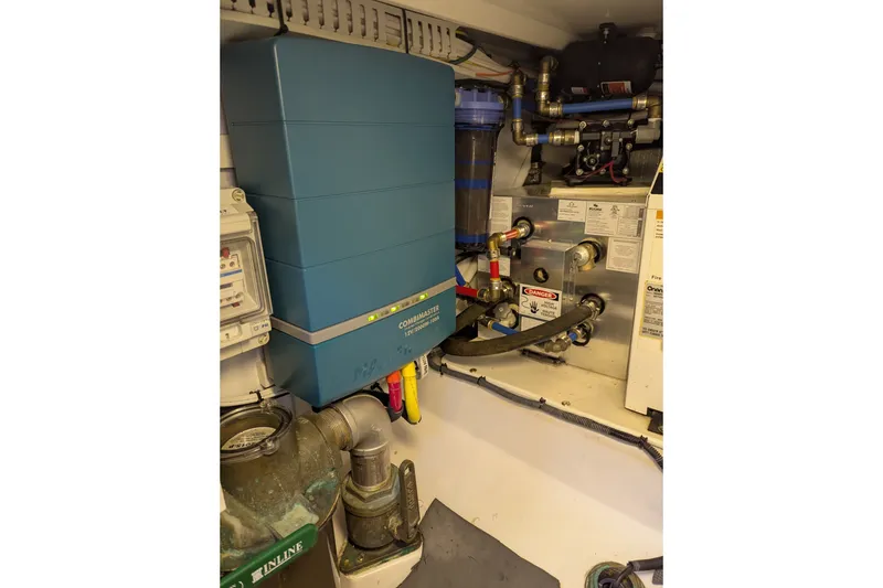 Slide: The Image of Electrical system setup in a 2007 Legacy 32 boat engine room. - 32