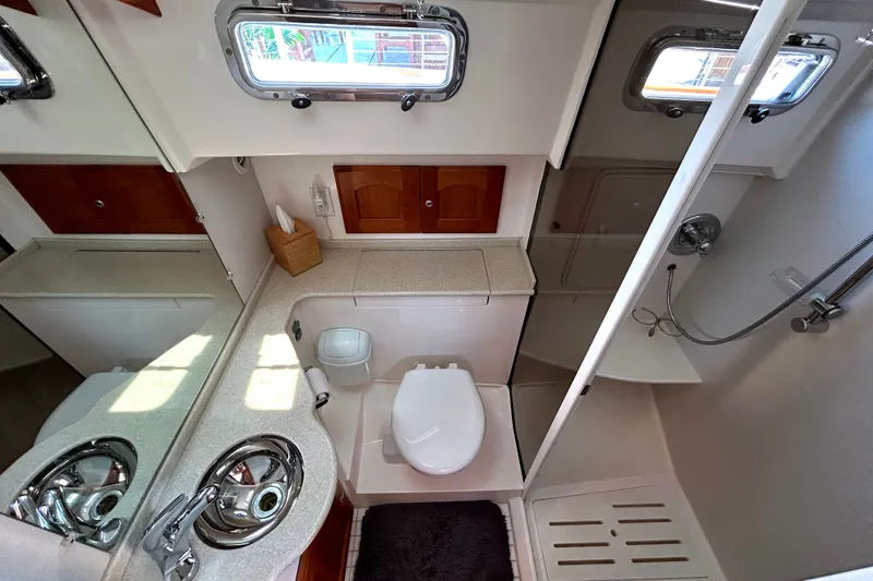 Slide: The Image of Luxurious 2007 Legacy 32 yacht bathroom with modern fixtures and elegant design. - 22