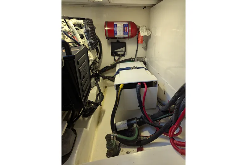 Slide: The Image of Engine compartment of a 2007 Legacy 32 boat with wiring and fire extinguisher. - 31