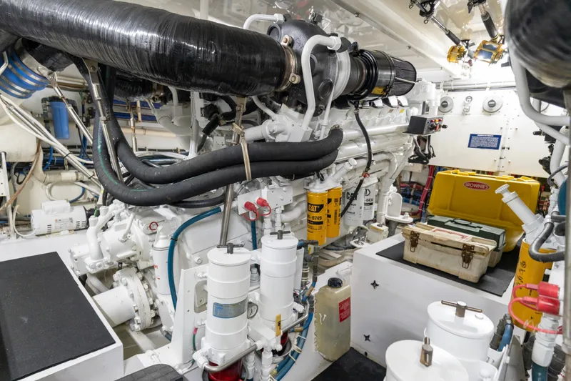 Slide: The Image of Engine room of a 2008 Hatteras 64 Motor Yacht, showcasing machinery and equipment. - 32