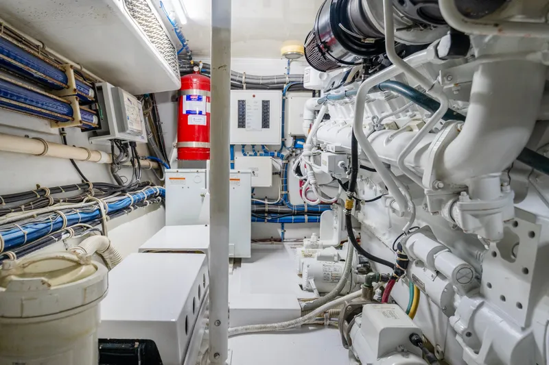 Slide: The Image of Engine room of 2008 Hatteras 64 Motor Yacht with visible machinery and wiring. - 36