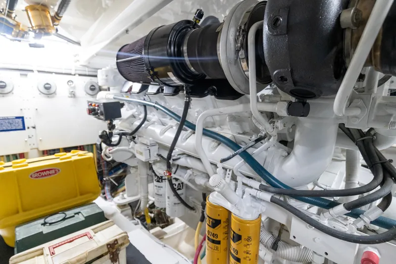 Slide: The Image of Engine room of 2008 Hatteras 64 Motor Yacht with visible machinery and components. - 28