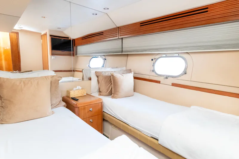 Slide: The Image of Luxurious cabin interior of 2008 Hatteras 64 Motor Yacht with twin beds and elegant decor. - 22