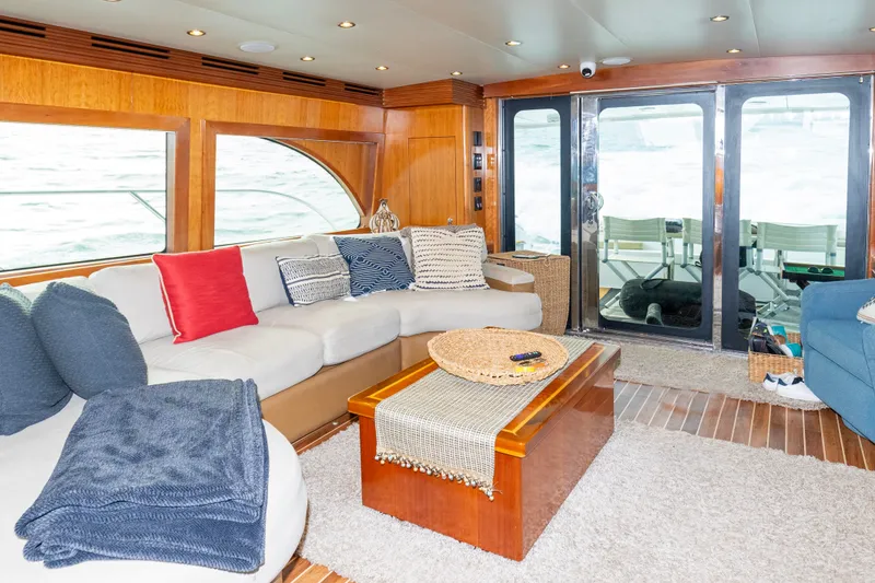 Slide: The Image of Luxurious interior of a 2008 Hatteras 64 Motor Yacht with cozy seating and elegant decor. - 2