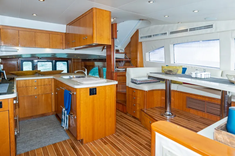 Slide: The Image of Luxurious interior of 2008 Hatteras 64 Motor Yacht with wood finishes and modern amenities. - 6