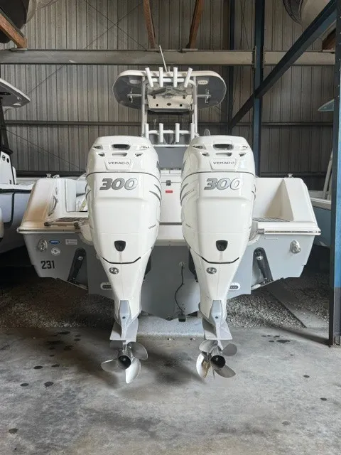 Slide: The Image of Two powerful outboard engines on a Tidewater 280 CC Adventure boat in a storage facility. - 26