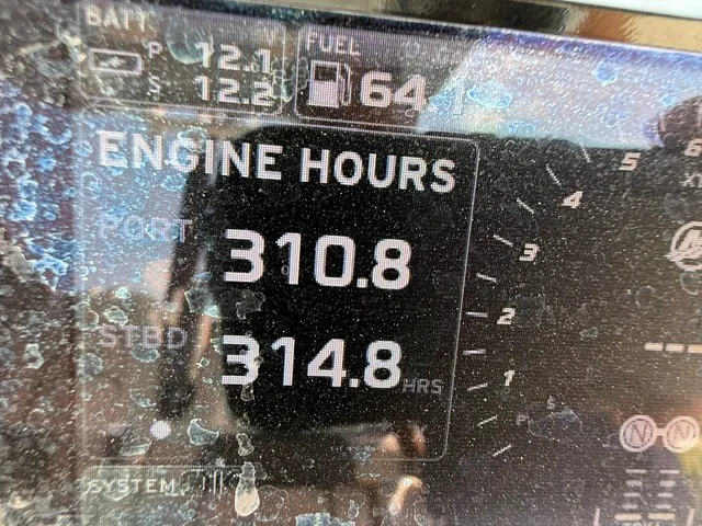 Slide: The Image of Close-up of a boat display showing engine hours and fuel level. - 21
