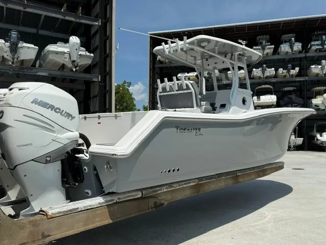 Slide: The Image of 2018 Tidewater 280 CC Adventure with Mercury outboard engine, stored in a boat warehouse. - 4