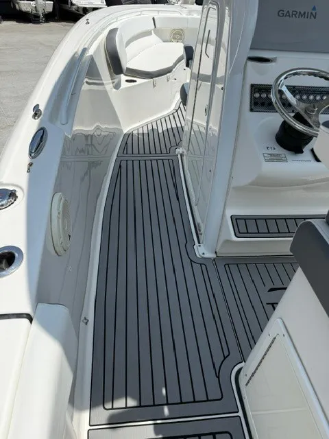 Slide: The Image of The image shows the cockpit of a 2018 Tidewater 280 CC Adventure with gray flooring. - 8