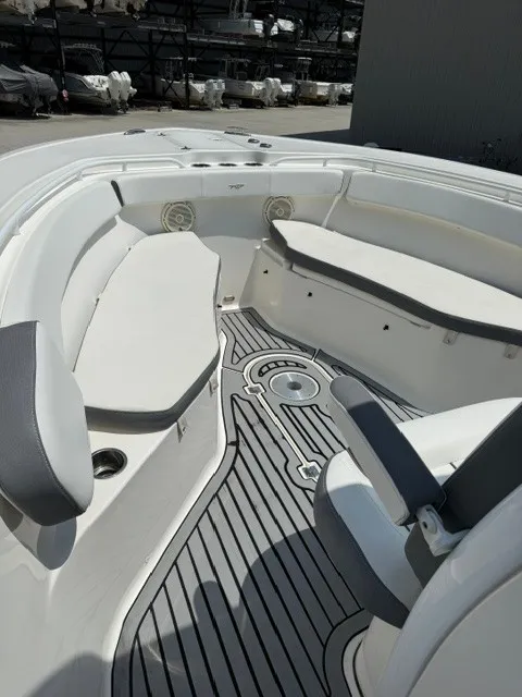 Slide: The Image of The image shows the cockpit of a 2018 Tidewater 280 CC Adventure with gray flooring and white seating. - 11