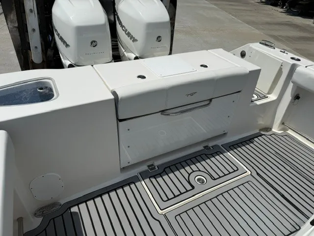 Slide: The Image of The image shows the stern of a Tidewater 280 CC Adventure boat with two Mercury engines. - 15