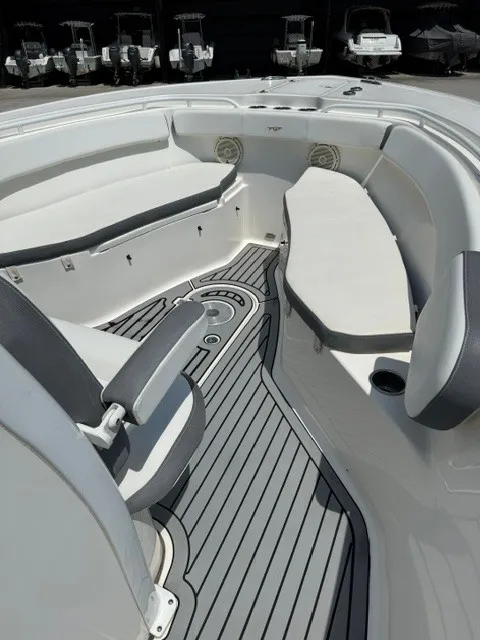 Slide: The Image of The image shows the cockpit of a 2018 Tidewater 280 CC Adventure with gray flooring. - 10