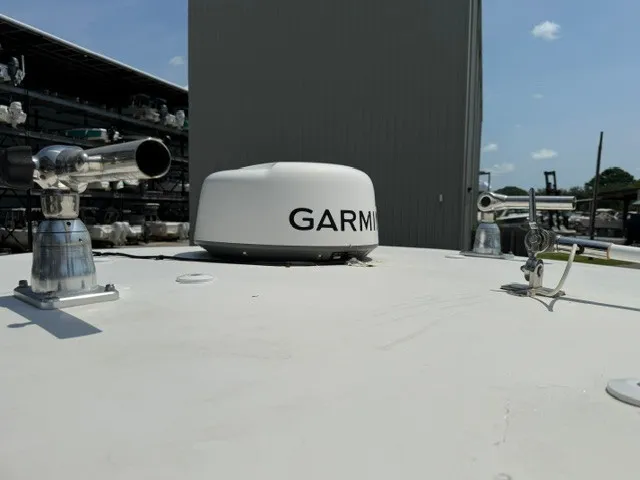 Slide: The Image of The image shows the roof of a boat with a Garmin radar and other equipment. - 22