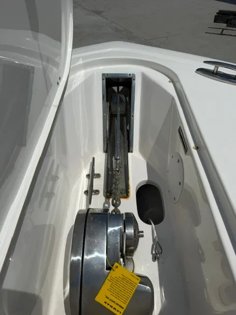 Slide: The Image of The anchor area of a 2018 Tidewater 280 CC Adventure with stainless steel windlass and chain guide. - 12