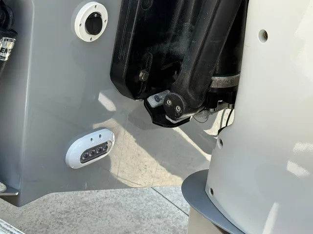 Slide: The Image of Close-up of a boat outboard motor with details of the mounting and lights. - 24