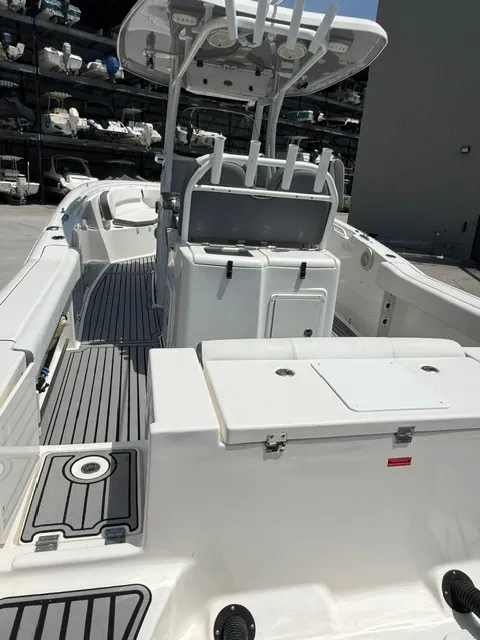 Slide: The Image of The image shows a 2018 Tidewater 280 CC Adventure boat with a spacious deck and modern features. - 5