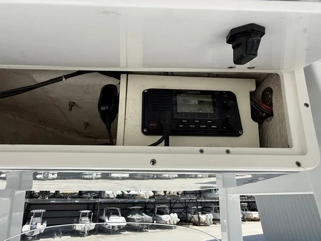 Slide: The Image of A Garmin radio is mounted in a compartment of a Tidewater 280 CC Adventure boat. - 17