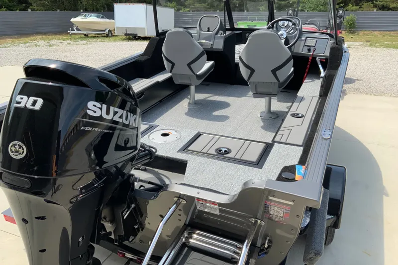 Slide: The Image of 2026 Starcraft Storm 166 DC Pro boat with Suzuki 90 engine, featuring dual seats and modern dashboard. - 2