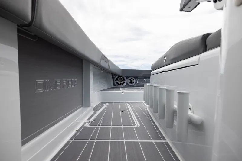 Slide: The Image of Interior view of 2026 Freeman 42LR boat, featuring sleek seating and rod holders. - 27