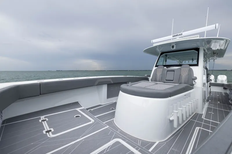 Slide: The Image of Modern Freeman 42LR boat, 2026 model, featuring sleek design and spacious deck on open water. - 20