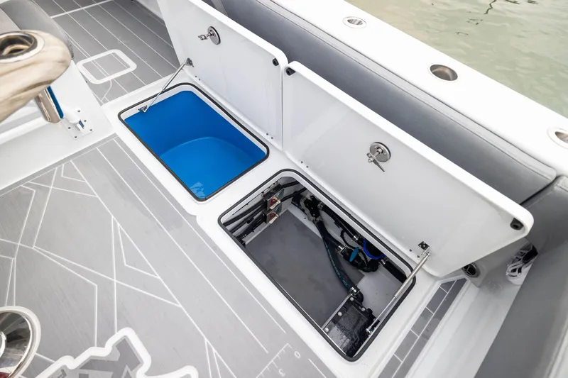 Slide: The Image of Freeman 42LR 2026 boat storage compartments with open hatches, showcasing interior features. - 52