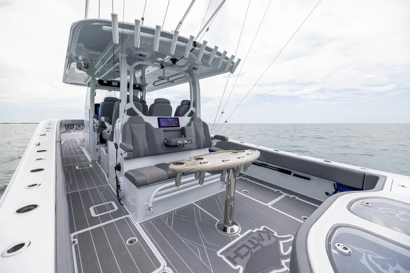 Slide: The Image of Luxurious 2026 Freeman 42LR boat interior with seating and fishing amenities on open water. - 41