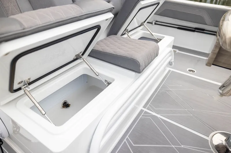 Slide: The Image of Freeman 42LR 2026 boat interior with open storage compartments and cushioned seating. - 44