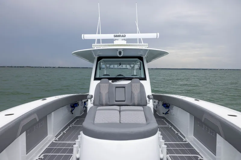 Slide: The Image of 2026 Freeman 42LR boat on water, featuring spacious seating and modern design. - 22