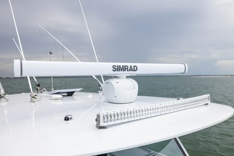 Slide: The Image of Rooftop of Freeman 42LR 2026 boat with Simrad radar system on open water. - 23