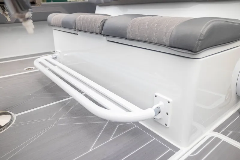 Slide: The Image of Interior seating of 2026 Freeman 42LR boat with cushioned bench and sleek flooring. - 45